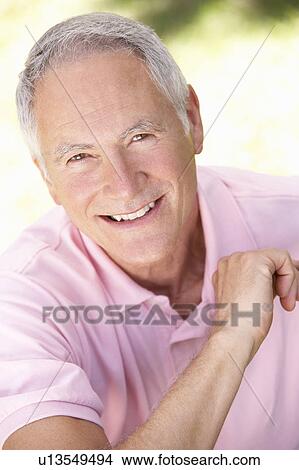 Senior man relaxing in a park View Large Photo Image Picture - Senior man relaxing in a park. Fotosearch