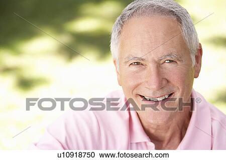 Senior man relaxing in a park View Large Photo Image Stock Image - Senior man relaxing in a park. Fotosearch