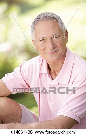 Senior man relaxing in a park View Large Photo Image Stock Photo - Senior man relaxing in a park. Fotosearch