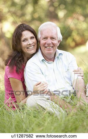 Stock Image - Senior Man With Adult Daughter In Park. Fotosearch