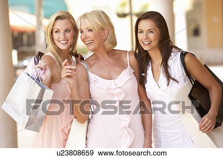 Senior Mother And Daughters Enjoying Shopping Trip Together View Large Photo Image Stock Photo - Senior Mother And Daughters Enjoying Shopping Trip Together. Fotosearch