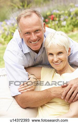 Senior Woman And Adult Son Relaxing In Garden View Large Photo Image Stock Image - Senior Woman And Adult Son Relaxing In Garden. Fotosearch