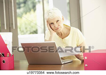 Picture - Senior Woman Using Laptop At Home. Fotosearch