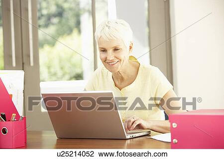 Senior Woman Using Laptop At Home View Large Photo Image Stock Image - Senior Woman Using Laptop At Home. Fotosearch