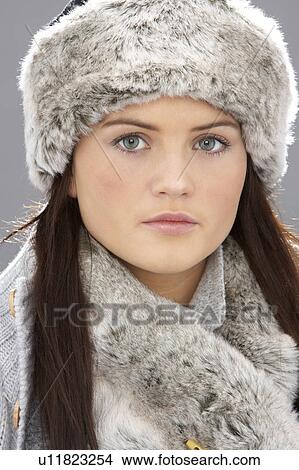 Studio Portrait Of Young Woman Wearing Fur Hat And Wrap View Large Photo Image Picture - Studio Portrait Of Young Woman Wearing Fur Hat And Wrap. Fotosearch