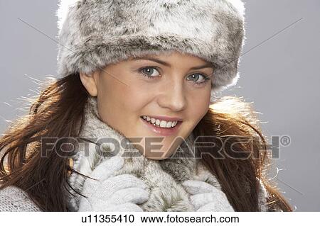Studio Portrait Of Young Woman Wearing Fur Hat And Wrap View Large Photo Image Stock Image - Studio Portrait Of Young Woman Wearing Fur Hat And Wrap. Fotosearch