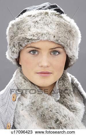 Studio Portrait Of Young Woman Wearing Fur Hat And Wrap View Large Photo Image Stock Image - Studio Portrait Of Young Woman Wearing Fur Hat And Wrap. Fotosearch