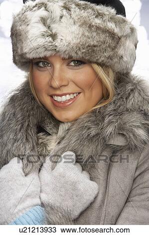 Studio Portrait Of Young Woman Wearing Fur Hat And Coat View Large Photo Image Stock Image - Studio Portrait Of Young Woman Wearing Fur Hat And Coat. Fotosearch
