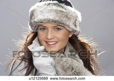 Studio Portrait Of Young Woman Wearing Fur Hat And Wrap View Large Photo Image Stock Photo - Studio Portrait Of Young Woman Wearing Fur Hat And Wrap. Fotosearch