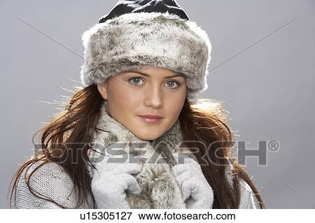 Studio Portrait Of Young Woman Wearing Fur Hat And Wrap View Large Photo Image Stock Photo - Studio Portrait Of Young Woman Wearing Fur Hat And Wrap. Fotosearch
