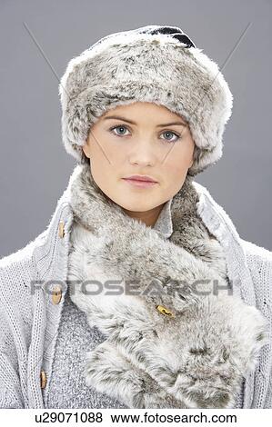 Studio Portrait Of Young Woman Wearing Fur Hat And Wrap View Large Photo Image Stock Photo - Studio Portrait Of Young Woman Wearing Fur Hat And Wrap. Fotosearch