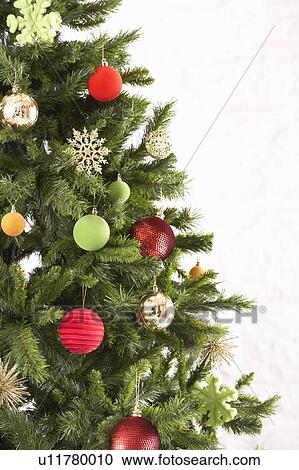Stock Image - Studio Shot Of Decorated Christmas Tree. Fotosearch