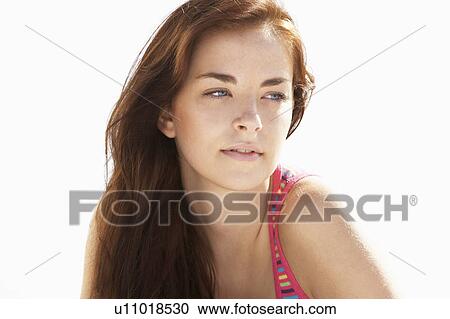 Stock Image - Teenage Girl Relaxing On Beach. Fotosearch