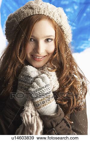 Stock Photo - Teenage Girl Wearing Warm Winter Clothes And Hat In Studio. Fotosearch