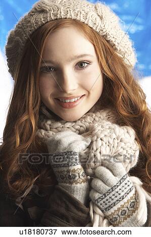 Stock Photo - Teenage Girl Wearing Warm Winter Clothes And Hat In Studio. Fotosearch