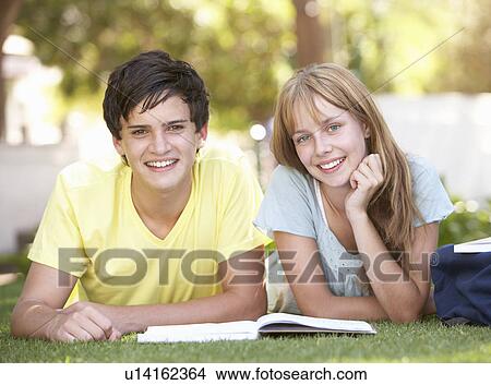 Teenage Student Couple Studying In Park View Large Photo Image Picture - Teenage Student Couple Studying In Park. Fotosearch