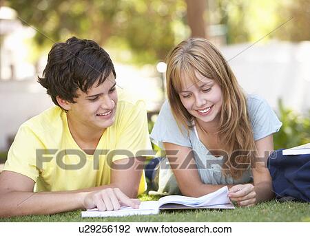 Teenage Student Couple Studying In Park View Large Photo Image Stock Image - Teenage Student Couple Studying In Park. Fotosearch