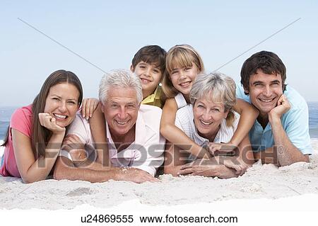 Three Generation Family Relaxing On Beach Holiday View Large Photo Image Stock Photography - Three Generation Family Relaxing On Beach Holiday. Fotosearch