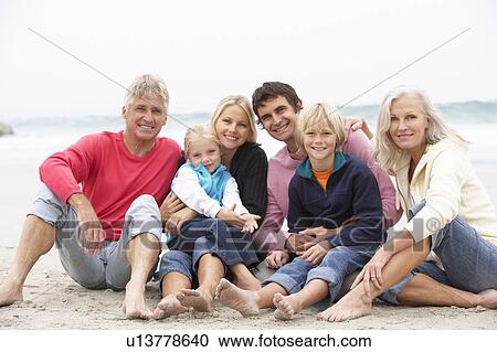 Three Generation Family Sitting On Winter Beach Together View Large Photo Image Stock Image - Three Generation Family Sitting On Winter Beach Together. Fotosearch
