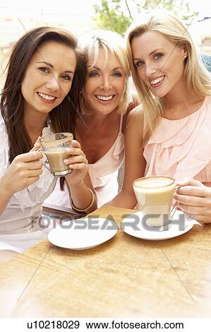 Three Women Enjoying Cup Of Coffee In Café View Large Photo Image Stock Photo - Three Women Enjoying Cup Of Coffee In Café. Fotosearch