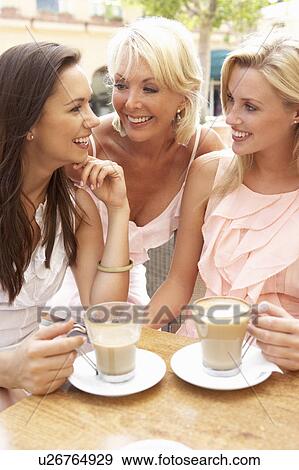 Three Women Enjoying Cup Of Coffee In Café View Large Photo Image Stock Photo - Three Women Enjoying Cup Of Coffee In Café. Fotosearch