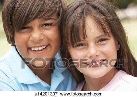 Two Children In Park Giving Each Other Hug View Large Photo Image Stock Photo - Two Children In Park Giving Each Other Hug. Fotosearch