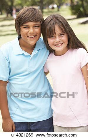 Stock Photo - Two Children In Park Giving Each Other Hug. Fotosearch