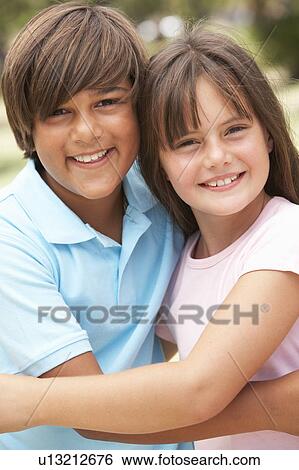Two Children In Park Giving Each Other Hug View Large Photo Image Stock Photograph - Two Children In Park Giving Each Other Hug. Fotosearch
