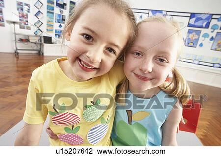 Two Female Primary Schoolchildren In Classroom View Large Photo Image Stock Image - Two Female Primary Schoolchildren In Classroom. Fotosearch