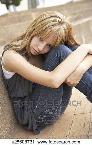 Unhappy Female Teenage Student Sitting Outside On College Steps Using Mobile Phone View Large Photo Image Stock Image - Unhappy Female Teenage Student Sitting Outside On College Steps Using Mobile Phone. Fotosearch