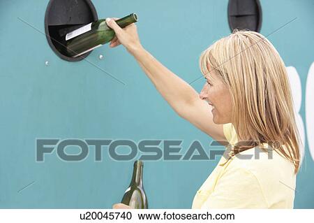 Woman At Recycling Centre Disposing Of Glass At Bottle Bank View Large Photo Image Stock Image - Woman At Recycling Centre Disposing Of Glass At Bottle Bank. Fotosearch