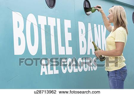 Woman At Recycling Centre Disposing Of Glass At Bottle Bank View Large Photo Image Stock Image - Woman At Recycling Centre Disposing Of Glass At Bottle Bank. Fotosearch