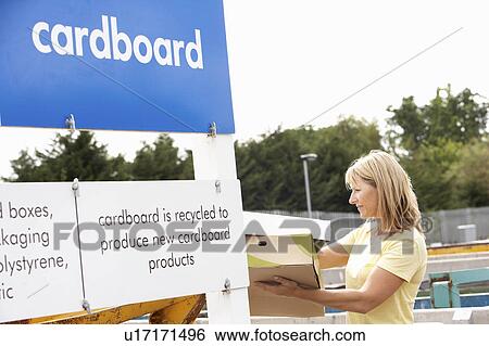 Woman At Recycling Centre Disposing Of Cardboard View Large Photo Image Stock Photograph - Woman At Recycling Centre Disposing Of Cardboard. Fotosearch
