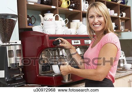 Stock Photo - Woman Making Coffee In Café. Fotosearch