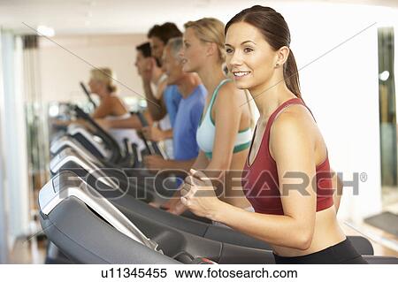 Woman On Running Machine In Gym View Large Photo Image Stock Photography - Woman On Running Machine In Gym. Fotosearch