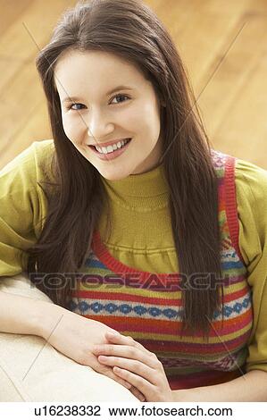 Woman Relaxing On Sofa At Home View Large Photo Image Stock Image - Woman Relaxing On Sofa At Home. Fotosearch