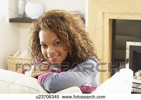 Woman Relaxing On Sofa At Home View Large Photo Image Stock Photography - Woman Relaxing On Sofa At Home. Fotosearch