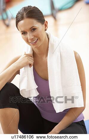 Stock Photograph - Woman Resting After Exercises In Gym. Fotosearch