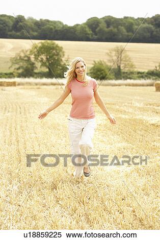 Woman Running Through Summer Harvested Field View Large Photo Image Stock Photography - Woman Running Through Summer Harvested Field. Fotosearch