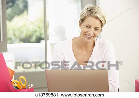 Woman Using Laptop At Home View Large Photo Image Stock Image - Woman Using Laptop At Home. Fotosearch