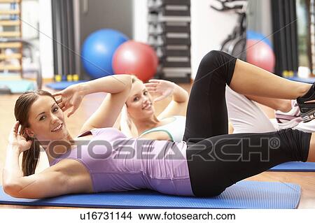 Women Doing Stretching Exercises In Gym View Large Photo Image Picture - Women Doing Stretching Exercises In Gym. Fotosearch