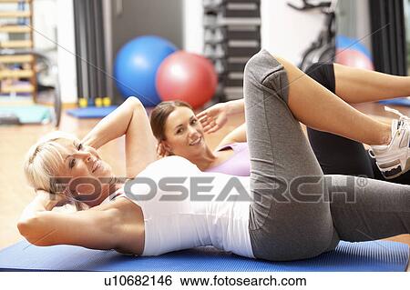 Women Doing Stretching Exercises In Gym View Large Photo Image Stock Photograph - Women Doing Stretching Exercises In Gym. Fotosearch