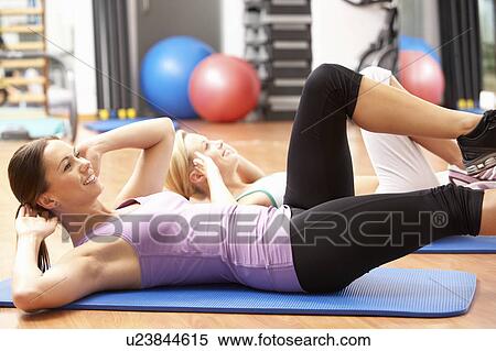Women Doing Stretching Exercises In Gym View Large Photo Image Stock Photography - Women Doing Stretching Exercises In Gym. Fotosearch