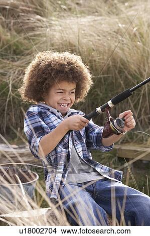 Young Boy Fishing At Seaside View Large Photo Image Picture - Young Boy Fishing At Seaside. Fotosearch