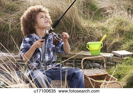 Young Boy Fishing At Seaside View Large Photo Image Stock Photography - Young Boy Fishing At Seaside. Fotosearch
