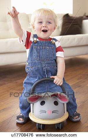 Young Boy Playing With Ride On Toy Mouse At Home View Large Photo Image Stock Photograph - Young Boy Playing With Ride On Toy Mouse At Home. Fotosearch
