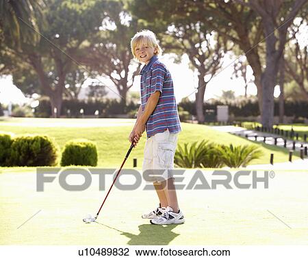 Young Boy Practising Golf On Putting On Green View Large Photo Image Stock Image - Young Boy Practising Golf On Putting On Green. Fotosearch