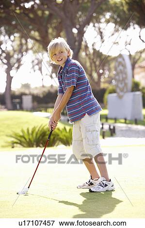 Young Boy Practising Golf On Putting On Green View Large Photo Image Stock Photo - Young Boy Practising Golf On Putting On Green. Fotosearch