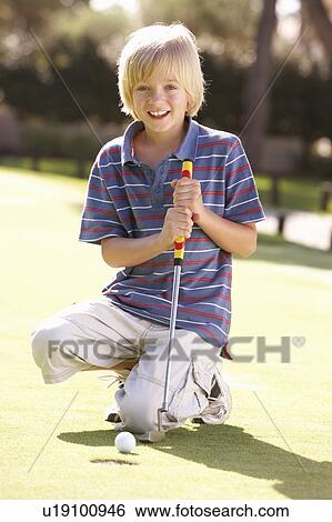 Young Boy Practising Golf On Putting On Green View Large Photo Image Stock Photograph - Young Boy Practising Golf On Putting On Green. Fotosearch