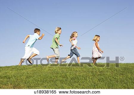 Young children running through field View Large Photo Image Stock Photography - Young children running through field. Fotosearch